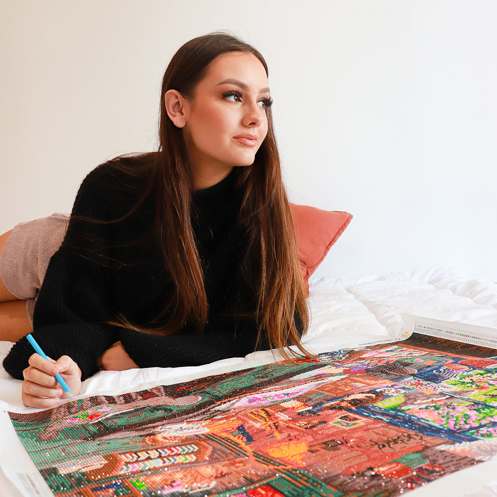 girl working on diamond painting